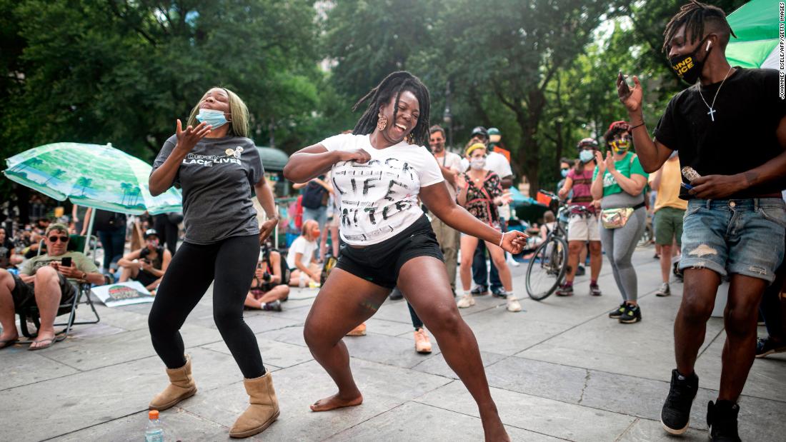 People dance in New York City during a protest to defund the police on June 26.