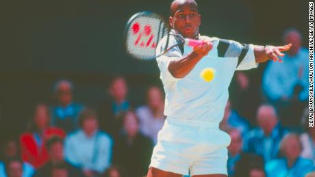Washington makes a forehand return against Todd Martin during their Wimbledon semifinal in July 1996.