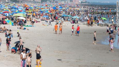 People visit the crowded beach at Coney Island on the Fourth of July as the city moves into Phase 2 of reopening.