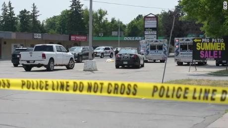 The crime scene outside a commercial plaza in a suburb of Toronto, Canada.