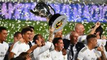 Real Madrid captain Sergio Ramos holds aloft La Liga trophy.
