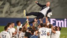 Real Madrid players celebrate with head coach Zinedine Zidane.