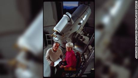 Carolyn and Eugene Shoemaker stand by the 18&quot; Schmidt Telescope at the Palomar Observatory. They used it to search for asteroids and comets that may come close to the earth&#39;s orbit. 
