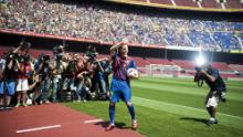 Fabregas gestures during his presentation as the new signing for FC Barcelona at Camp Nou sports complex on August 15, 2011 in Barcelona, Spain.