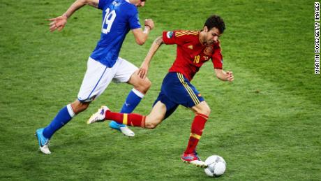 Fabregas (R) runs with the ball past Leonardo Bonucci of Italy during the UEFA EURO 2012 final match between Spain and Italy at the Olympic Stadium on July 1, 2012 in Kiev, Ukraine. 