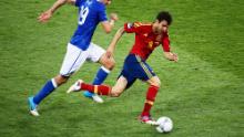 Fabregas (R) runs with the ball past Leonardo Bonucci of Italy during the UEFA EURO 2012 final match between Spain and Italy at the Olympic Stadium on July 1, 2012 in Kiev, Ukraine. 