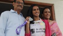 &#39;Your rock and pillars&#39;: Sindhu with her father Ramana (L) and mother Vijaya (R) who have played a central role in her upward trajectory