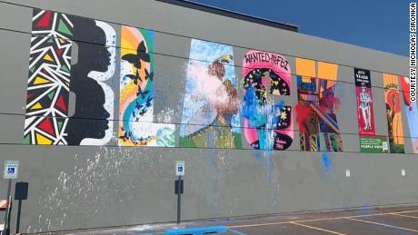 A Black Lives Matter mural is defaced with red, white and blue paint in Washington state