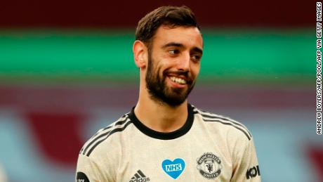 Manchester United&#39;s Portuguese midfielder Bruno Fernandes grins during the English Premier League football match between Aston Villa and Manchester United at Villa Park in Birmingham, central England on July 9, 2020. (Photo by ANDREW BOYERS / POOL / AFP) / RESTRICTED TO EDITORIAL USE. No use with unauthorized audio, video, data, fixture lists, club/league logos or &#39;live&#39; services. Online in-match use limited to 120 images. An additional 40 images may be used in extra time. No video emulation. Social media in-match use limited to 120 images. An additional 40 images may be used in extra time. No use in betting publications, games or single club/league/player publications. /  (Photo by ANDREW BOYERS/POOL/AFP via Getty Images)