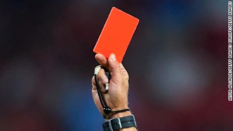 SEVILLE, SPAIN - JULY 26:  Letonian referee Andris Treimanis shows red card to Pauljevic (not in picture) of Ujpest during Sevilla v Ujpest UEFA Europa League Second Qualifying Round 1st leg match at Estadio Ramon Sanchez Pizjuan on July 26, 2018 in Seville, Spain.  (Photo by Aitor Alcalde/Getty Images)