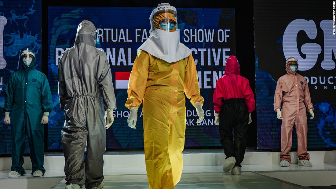 Medical workers in Yogyakarta, インドネシア, showcase designs during a fashion show of personal protective equipment on August 1. The fashion show was held as a form of gratitude for all medical personnel who have been fighting Covid-19.