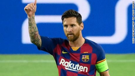 Lionel Messi celebrates after scoring Barcelona&#39;s brilliant second goal against Napoli in the Champions League last 16 second round tie in the Camp Nou.