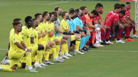 FC Dallas Team (R) and Nashville SC Team get to their knees during the national anthem prior the game game between FC Dallas and Nashville SC as part of the Major League Soccer 2020 at Toyota Stadium on August 12, 2020 in Frisco, Texas. 