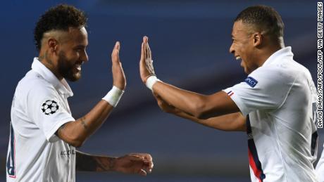 TOPSHOT - Paris Saint-Germain&#39;s Brazilian forward Neymar (L) and Paris Saint-Germain&#39;s French forward Kylian Mbappe celebrate after winning  at the end of the UEFA Champions League quarter-final football match between Atalanta and Paris Saint-Germain at the Luz Stadium in Lisbon on August 12, 2020. (Photo by David Ramos / POOL / AFP) (Photo by DAVID RAMOS/POOL/AFP via Getty Images)