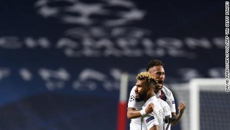 Eric Maxim Choupo-Moting (right) and Neymar react during PSG's Champions League quarterfinal victory.