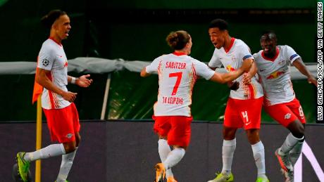 Leipzig&#39;s US midfielder Tyler Adams (2R) celebrates after scoring a goal during the UEFA Champions League quarter-final football match between Leipzig and Atletico Madrid at the Jose Alvalade stadium in Lisbon on August 13, 2020. (Photo by LLUIS GENE / POOL / AFP) (Photo by LLUIS GENE/POOL/AFP via Getty Images)