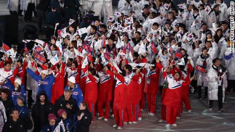 Team North Korea and Team South Korea walk together in the Parade of Athletes during the Closing Ceremony of the PyeongChang 2018 Winter Olympic Games.