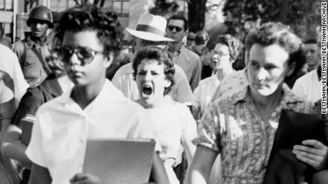 Elizabeth Eckford, one of the &quot;Little Rock Nine,&quot; ignores the jeers and stares of fellow students on her first day of class at Little Rock&#39;s Central High School in 1957.