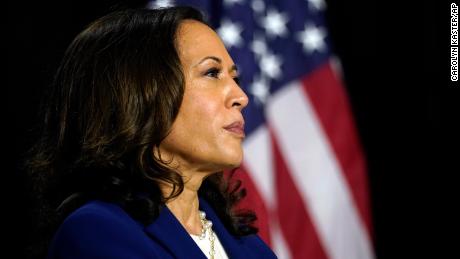 Sen. Kamala Harris, D-Calif., listens as Democratic presidential candidate former Vice President Joe Biden introduces her as his running mate at Alexis Dupont High School in Wilmington, Del., Wednesday, Aug. 12, 2020. 