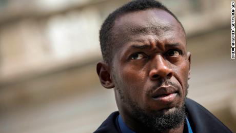 Track star and new Bolt pitchman Usain Bolt looks on during a press conference about the new Bolt Mobility scooter outside of New York City Hall, March 12, 2019 in New York City.