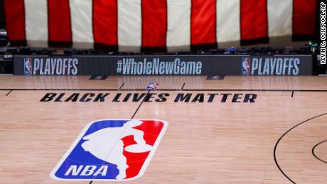 An empty court and bench are shown following the scheduled start time of Game 5 of an NBA first-round playoff series.