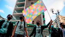 High school students join hands to form a protest chain in the Kwun Tong area of Kowloon in Hong Kong on September 24, 2019.