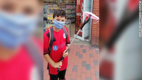 Jojo Eisawy, 9, shows off the discarded face mask found on his litter pick up.