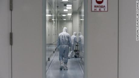Employees walk on May 20 in a passage at the headquarters of Russia&#39;s biotech company BIOCAD, which has been working on a vaccine against the coronavirus.