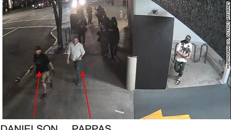 Photos taken from surveillance video shortly before the fatal shooting in Portland show Michael Reinoehl inside the entrance of a parking garage, just feet from Aaron Danielson. 