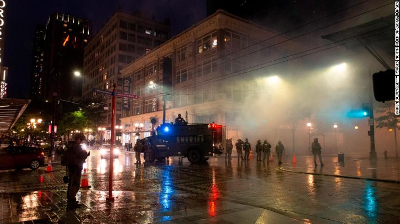 Man charged with stealing a police gun during Seattle protests identified with the help of a YouTube video