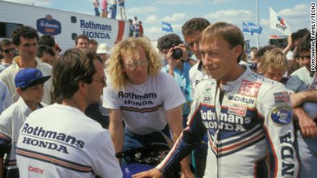 Poncharal chats with engineer Guy Coulon (center) and rider Olivier Jacque (right). 