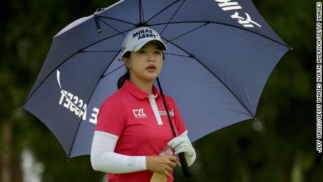 World No.6 Sei Young Kim uses a umbrella to protect herself from the sun during the first round of the ANA Inspiration.