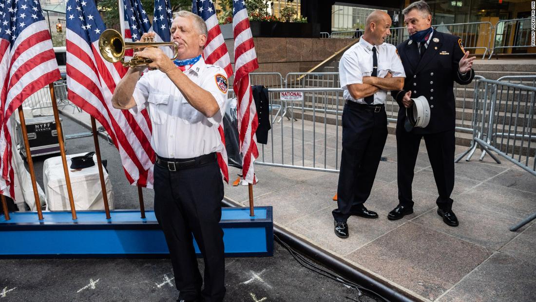 A firefighter bugler practices prior to the start of the Tunnel to Towers ceremony.