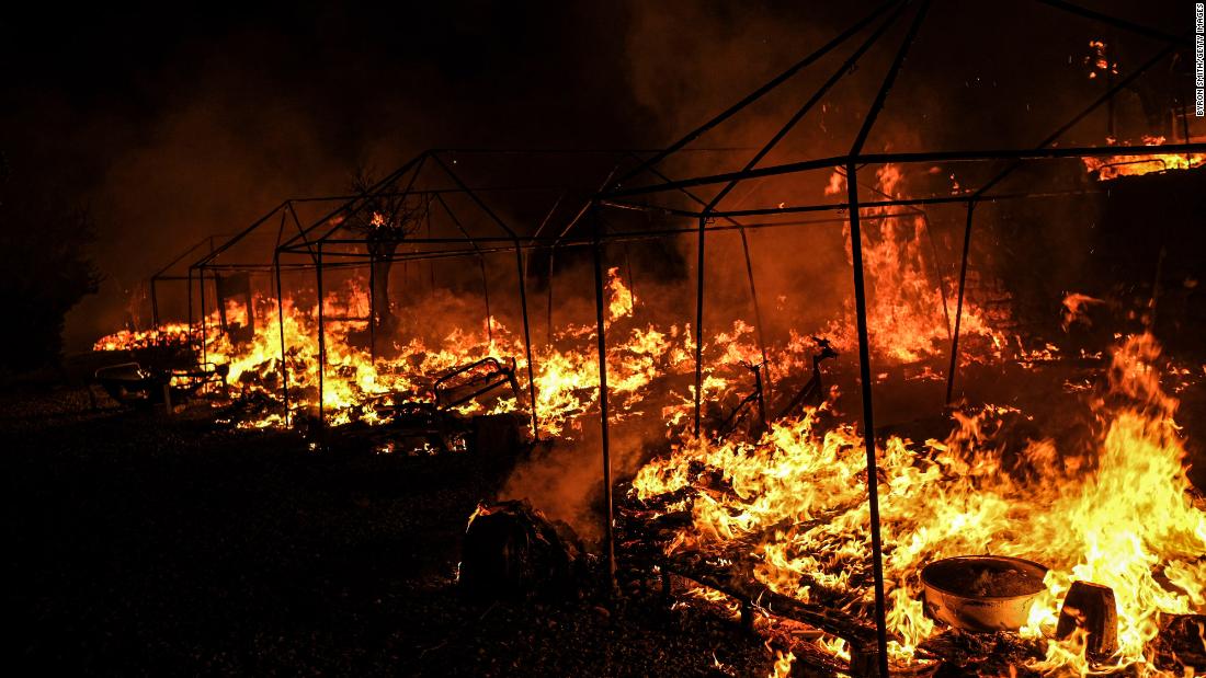 Fires rage in the Moria camp on September 9. Greek authorities said the fires appeared to have been deliberately lit after quarantine rules were imposed on residents who had tested positive for coronavirus. The camp was put under lockdown after 35 people tested positive for Covid-19.
