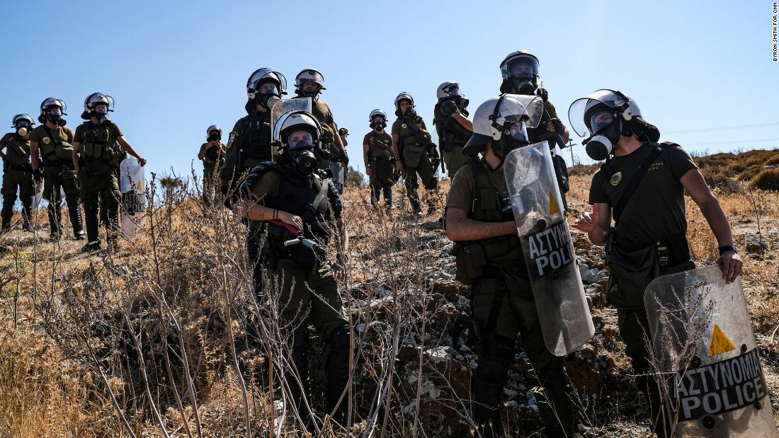 Greek police keep tabs on migrant protests on September 11.