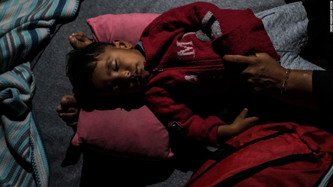 An Afghan child rests after fires broke out in the Moria migrant camp on Tuesday, September 9.
