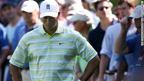 Woods hangs his head after hitting it into the rough on the 15th hole during the opening round of the 2006 U.S. Open.