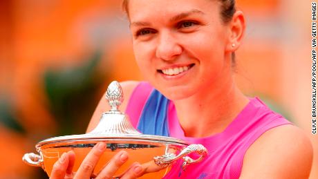 Halep poses with her trophy after winning Italian Open.