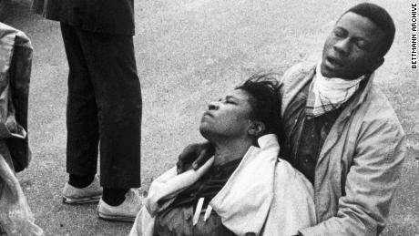 A civil rights marcher, suffering from exposure to tear gas, holds an unconscious Amelia Boynton after the police attacked marchers in Selma, Alabama, on March 7, 1965.