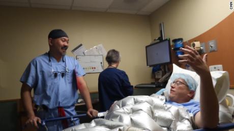 Dr. Demetrio Aguila consults with M25 patient Jeff Jensen prior to his surgery.