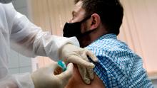 Volunteer Ilya Dubrovin, 36, gets a shot in Russia&#39;s human trials of its Sputnik V coronavirus vaccine at a clinic in Moscow in September. 
