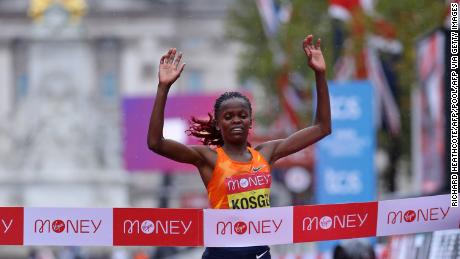 Kosgei crosses the finish line to defend her title in London. 