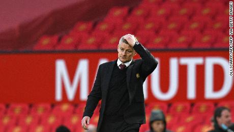 Solskjaer walks off the pitch following his side&#39;s defeat. 