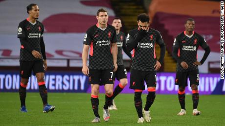 Mo Salah (right) and James Milner look on in Liverpool&#39;s thrashing by Aston Villa. 
