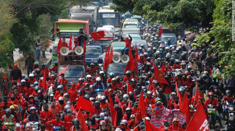 Indonesians police fire water cannons at protesters rallying against jobs law