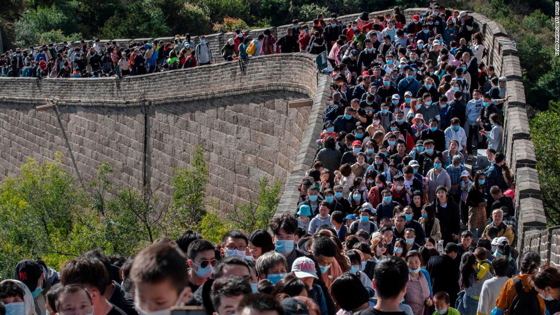 Tourists crowd together in Beijing as they move slowly on a section of the Great Wall of China on October 4. The scene would have been unthinkable just months ago.
