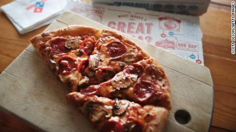 Domino&#39;s said its pizza delivery times are increasing a bit in some areas because of staffing shortages.