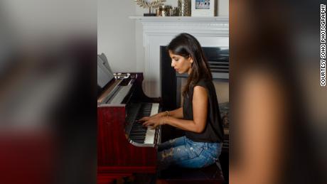 Sheena Melwani at her piano. In her videos, her offscreen heckler is never seen.
