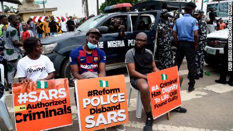 Nigerians take to the streets in mass protests against controversial police unit accused of brutality 