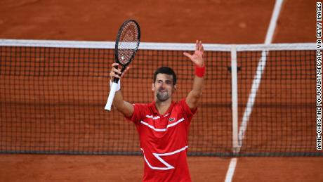 Djokovic celebrates his five-set victory over Tsitsipas. 